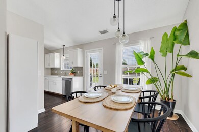Tons of natural light in every space + updated lighting throughout! The exterior door leads the deck and back yard.