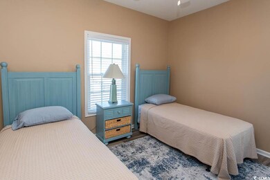 Bedroom with dark hardwood / wood-style floors and