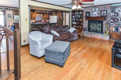 living room with raised fireplace