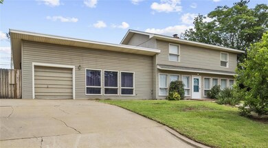 View of front facade with an attached garage and driveway