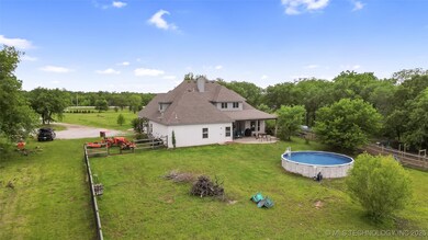 Rear view of property featuring a patio, an outdoo