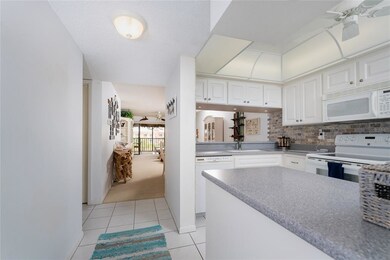 JUST INSIDE THE ENTRY DOOR, THE MODERN KITCHEN IS 