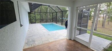 Outdoor pool featuring a patio area and a lanai