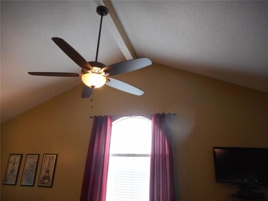The vaulted ceiling between the living room and fo