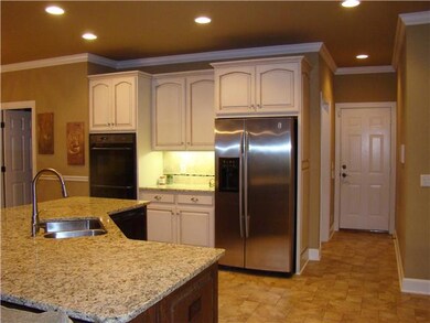 Large Island with SS sink, dishwasher, granite counter tops.