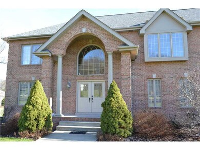 Exterior Front. Welcoming double-door entry with m
