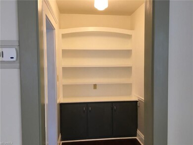 Butler's pantry located between the dining room and kitchen