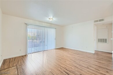 Empty room featuring light hardwood / wood-style f