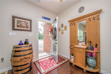 Enter the home and immediately notice the wood flo