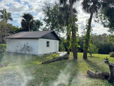View of property exterior with a lawn