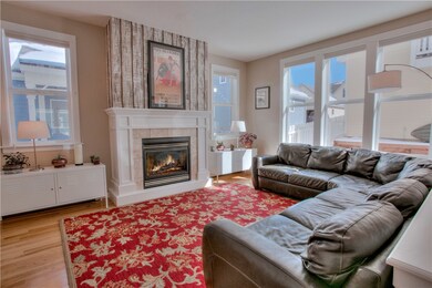 Sit by the fire in this warm and roomy living area