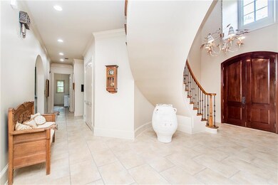 Spectacular inviting entry foyer. Note rich double