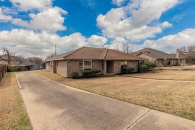 View of front of home featuring a tiled roof, a fr