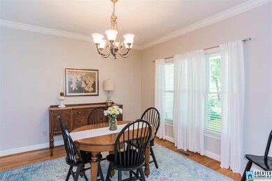 Spacious dining room with large windows, hardwood 