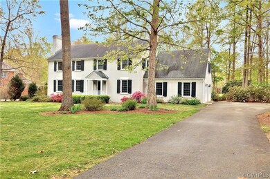 Double chimneys, paved driveway and attached 2 car