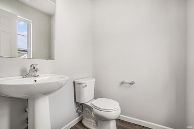 The powder room is located toward the front of the