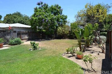 Large back yard with mature trees and huge lawn.