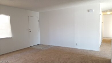 Entry Foyer to living room with new carpet and pai