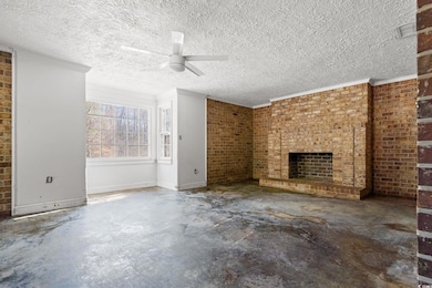 Unfurnished living room with concrete flooring, a 