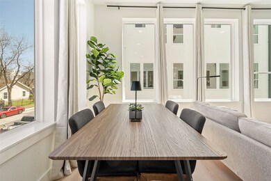 Dining room with visible vents and wood finished floors