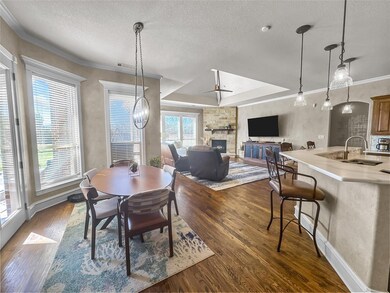 Dining area featuring visible vents, dark wood-sty