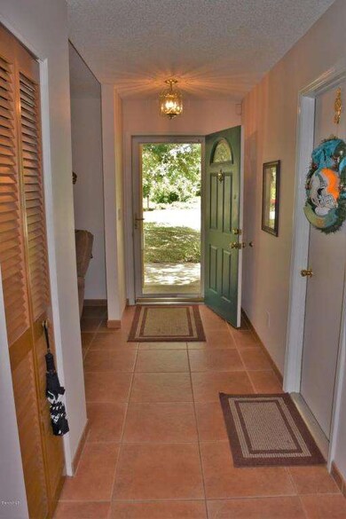 Inviting Foyer With Glass Storm Door!