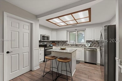 Kitchen w/access to HUGE laundry room thru door.