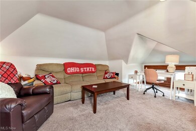 Bonus room featuring lofted ceiling and light colored carpet