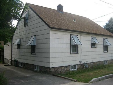 Exterior Back. Driveway in back of home.  room for