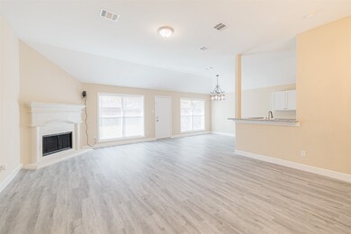The spacious family room, with its gas-log cast-st