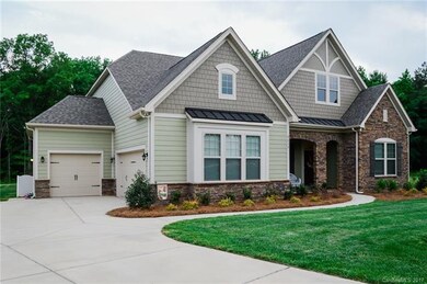 3 Car Garage and Long Driveway