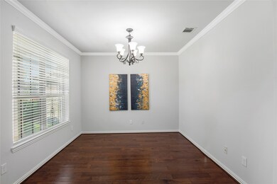 This versatile space offers a formal dining area, perfect for transforming into a home office or flex room.