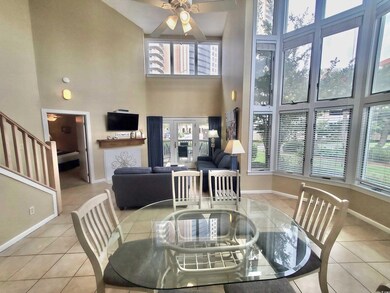 Dining room with light tile patterned flooring, a 