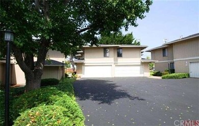 Well kept exterior leading up to two car garage.