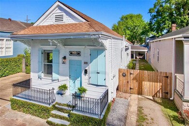 Eastlake Queen Anne Style Shotgun Cottage with orn