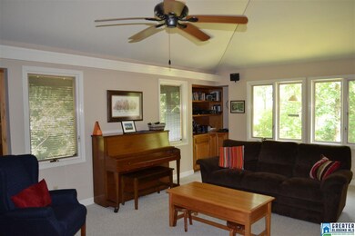 Huge living room with built-in shelving in corners