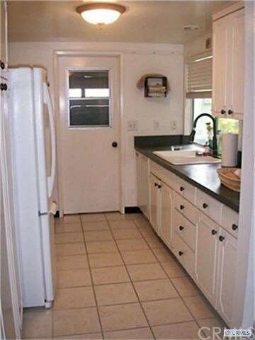 Functional kitchen has plenty of counter space. Do