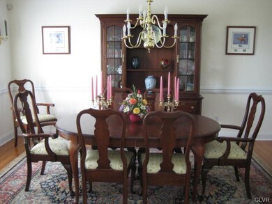 Formal dining room is accented crown molding and c