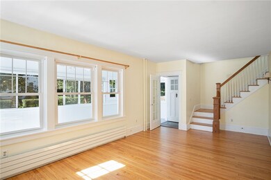 Living room with gleaming hardwood floors.