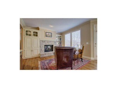 Hearth room w/ stone fireplace and built-ins.