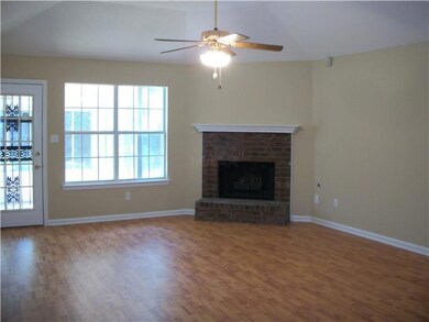 Great room with wood laminate floors, new paint an