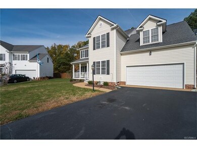 Front Elevation with Dormer and Paved Driveway to 