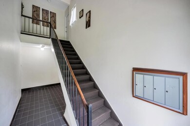 Staircase featuring tile patterned flooring