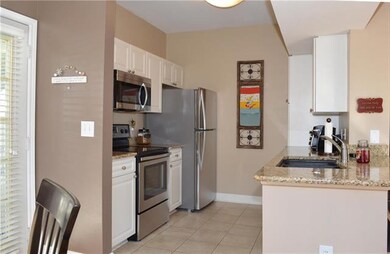 Look at the newer Granite, Sink and Faucet; near S