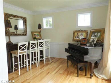 Dining Room - Formal diningroom with wainscotting and moldings.  Currently used as music room.