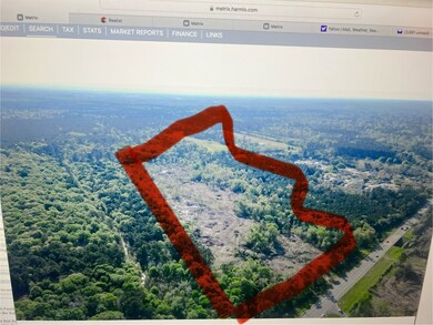 You can see the small paved country road to a resi