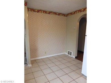 Eat in kitchen with tile floor.