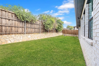 View of fenced backyard