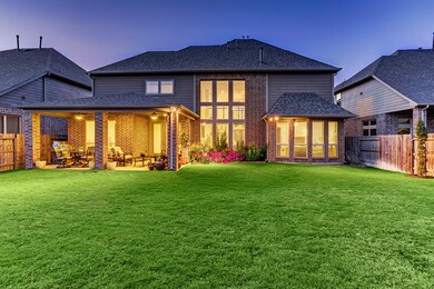 BACK ELEVATION... Pool sized backyard, expanded covered patio, fenced yard and colorful landscaping are some of the features of this spacious backyard.  Provides plenty of room for the children or pets to play.