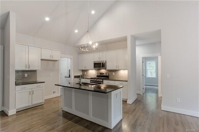 Kitchen w/White Cabinets.